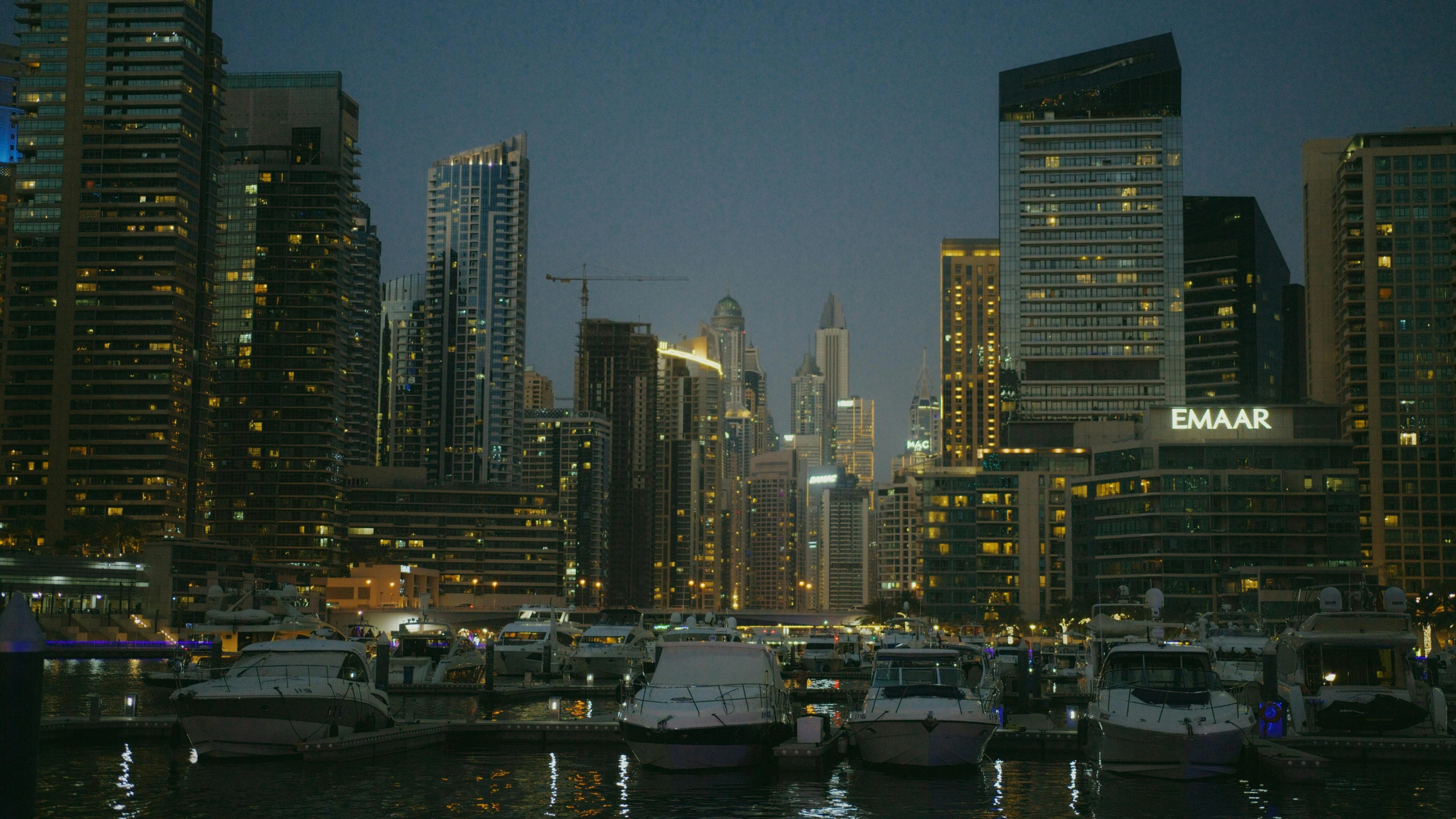 a city skyline with boats and buildings